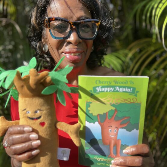 joyce with her book and CW Affirmation Tree